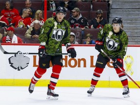 Ottawa Senators right wing Bobby Ryan (9) and Ryan Dzingel and their teammates wore camouflage uniforms during warmup on the 13th annual Canadian Forces Appreciation Night at Canadian Tire Centre before taking on the Carolina Hurricanes on Tuesday November 1, 2016.