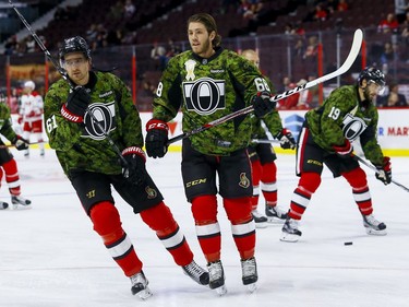 Ottawa Senators right wing Mark Stone (61) and left wing Mike Hoffman (68) and their teammates wore camouflage uniforms during warmup on the 13th annual Canadian Forces Appreciation Night at Canadian Tire Centre before taking on the Carolina Hurricanes on Tuesday November 1, 2016. Errol McGihon/Postmedia