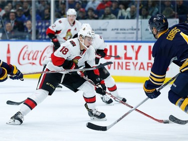 Ryan Dzingel #18 of the Ottawa Senators shoots the puck as Josh Gorges #4 of the Buffalo Sabres defends during the first period at the KeyBank Center on November 9, 2016 in Buffalo, New York.