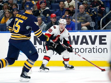 Ryan Dzingel #18 of the Ottawa Senators skates with the puck as Rasmus Ristolainen #55 of the Buffalo Sabres defends during the first period at the KeyBank Center on November 9, 2016 in Buffalo, New York.