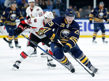 Jake McCabe #29 of the Buffalo Sabres skates into the zone as Matt Puempel #26 of the Ottawa Senators pursues during the first period at the KeyBank Center on November 9, 2016 in Buffalo, New York.