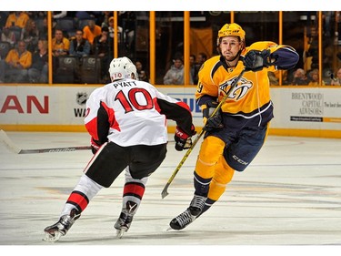 NASHVILLE, TN - NOVEMBER 08:  Filip Forsberg #9 of the Nashville Predators skates past Tom Pyatt #10 of the Ottawa Senators during the first period at Bridgestone Arena on November 8, 2016 in Nashville, Tennessee.