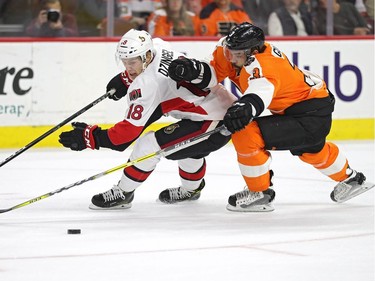 Ryan Dzingel #18 of the Ottawa Senators skates with the puck past Radko Gudas #3 of the Philadelphia Flyers during the first period at Wells Fargo Center on November 15, 2016 in Philadelphia, Pennsylvania.