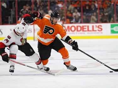 Michael Raffl #12 of the Philadelphia Flyers skates past Mark Borowiecki #74 of the Ottawa Senators during the second period at Wells Fargo Center on November 15, 2016 in Philadelphia, Pennsylvania.