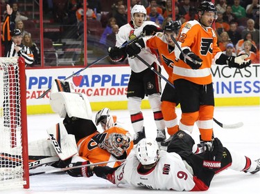 Bobby Ryan #9 of the Ottawa Senators collides with goalie Steve Mason #35 of the Philadelphia Flyers during the first period at Wells Fargo Center on November 15, 2016 in Philadelphia, Pennsylvania.