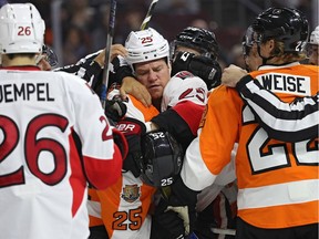 Chris Neil #25 of the Ottawa Senators and Nick Cousins #25 of the Philadelphia Flyers push and shove during the first period at Wells Fargo Center on November 15, 2016 in Philadelphia, Pennsylvania.