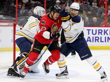 Ottawa's Chris Neil (left) mixes it up with Josh Gorges in front of Lehner's net during first-period action between the Ottawa Senators and the Buffalo Sabres Tuesday (Nov. 29, 2016) at the Canadian Tire Centre in Ottawa. Julie Oliver/Postmedia