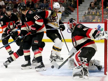 Ottawa's Craig Anderson stops a bouncing puck in front of his net during first-period action of the Ottawa Senators matchup against the Boston Bruins Thursday (Nov.4, 2016) at Canadian Tire Centre in Ottawa.