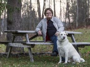 Photographer William McElligott and his dog, Quincy, at their Meech Lake Home.