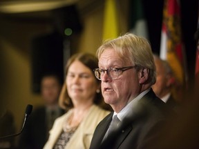 Quebec Health Minister Gaetan Barrette answers questions during a federal, provincial and territorial health ministers' meeting in Toronto on Tuesday, October 18, 2016.