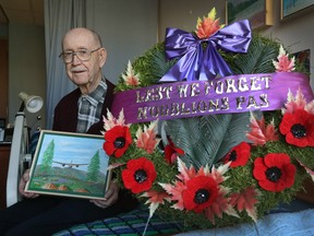 WWII vet Jack Dods poses for a photo at the Perley Rideau Veteran's Health Centre in Ottawa Tuesday Nov 8, 2016. Jack is a painter who recreates scenes from his Second World War.