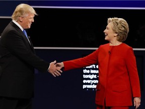Republican presidential nominee Donald Trump and Democratic presidential nominee Hillary Clinton shake hands during the presidential debate at Hofstra University in Hempstead, N.Y., Monday, Sept. 26, 2016.