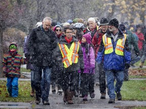 Residents gathered for a march against racism on Sunday, Nov. 20, 2016, a day after a minor was charged for hate graffiti painted on several Ottawa buildings in the past week.