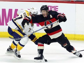 Ottawa Senators' Kyle Turris (7) runs into Nashville Predators' Yannick Weber (7) during first period NHL hockey action in Ottawa on Thursday, November 17, 2016.