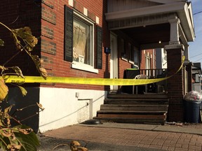 Police watch a scene Saturday morning following a shooting of a 21-year-old man Friday afternoon on Catherine Street.