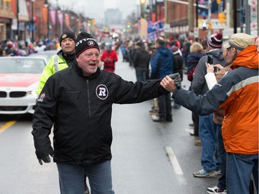 Team president Jeff Hunt greets fans on Bank St as the Ottawa Redblacks celebrate their Grey Cup victory with a parade down Bank St and a celebration at Lansdowne Park.