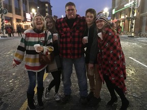 The MacFarlanes are one big happy family on Sunday, Nov. 20, 2016, after seeing the Ottawa RedBlacks make it to next weeklend's Grey Cup in Toronto. Credit: Susana Mas, Postmedia