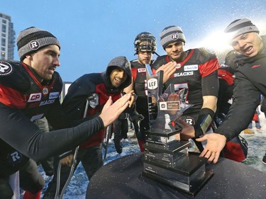 The Ottawa Redblacks celebrate their team's CFL's East Division Final victory against the Edmonton Eskimos during second half of the held at TD Place in Ottawa, November 20, 2016.