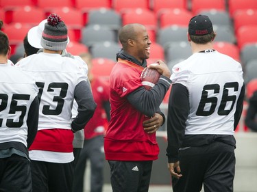 The Ottawa Redblacks had a walkthrough practice at TD Place on Saturday, Nov. 19, 2016, a day ahead of the CFL East final. Redblacks quarterback Henry Burris laughs it up with teammates.