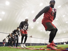 The Ottawa Redblacks warm up at practice for the 104th Grey Cup, in Toronto on Friday, November 25, 2016.