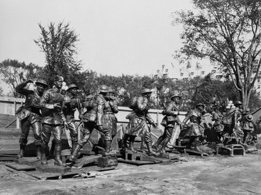 These figures, laid out on the ground before being incorporated in the War Memorial's granite arch, symbolize the 'going forth of the people.' Capturing the diversity of the Canadian response, the 22 figures represent infantry, cavalry, riflemen, gunners, pilots, sailors, nursing sisters and lumbermen.