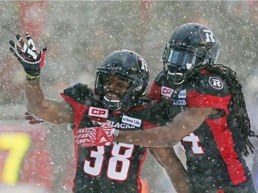 Tristan Jackson (L) of the Ottawa Redblacks celebrates his touchdown with Abdul Kanneh against the Edmonton Eskimos during the second half of the CFL's East Division Final the held at TD Place in Ottawa, November 20, 2016.