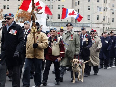 Veterans march at Remembrance Day ceremonies at the War Memorial in Ottawa on Friday, November 11, 2016.