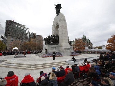 Veterans watch Remembrance Day ceremonies at the War Memorial in Ottawa on Friday, November 11, 2016.