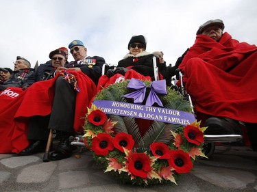 Veterans watch the Remembrance Day ceremonies at the War Memorial in Ottawa on Friday, November 11, 2016.