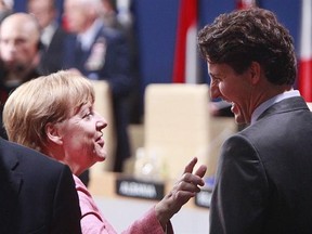 German Chancellor Angela Merkel,left, talks with Canadian Prime Minister Justin Trudeau prior to the meeting of the NATO-Ukraine Commission, during the second day of the NATO Summit in Warsaw, Poland, Saturday, July 9, 2016. Trudeau talked trade during a telephone call today with Merkel.Germany is Europe&#039;s biggest economy and the two leaders affirmed their support for the Canada-EU free trade deal, which both sides hope to finalize next year. THE CANADIAN PRESS/AP Photo/Czarek Sokolowski)