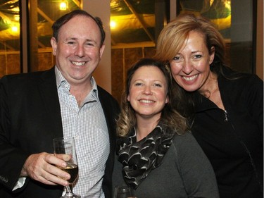 A Christmas Carol cast member Chris Ralph (Fezziwig), with his wife, Nicole Milne, and the play's set and costume designer, Bretta Gerecke, at the National Arts Centre on Friday, December 16, 2016, for the opening night of the holiday classic.