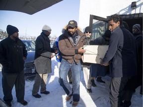 A funeral was held at the Jami Omar Mosque in Ottawa Sunday December 18, 2016 for sisters Asma A-Noor, 32, and Nasiba A-Noor, 29 who were killed Friday night. Their brother, Musab A-Noor, 29, has been charged with first-and second-degree murder in their deaths. Men carry the casket of one of the sisters out of the mosque to an awaiting van to bring them to rest at the Ottawa Muslim Cemetery.