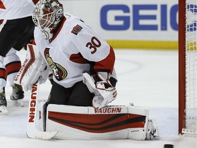 Ottawa Senators goalie Andrew Hammond (30) deflects a shot by the Anaheim Ducks during the second period of an NHL hockey game in Anaheim, Calif., Sunday, Dec. 11, 2016.