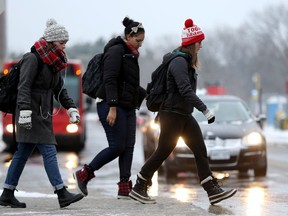 As snow turned to drizzle overnight, morning commuters made their way through soggy conditions around Carleton University Wednesday (Dec. 7, 2016). Julie Oliver/Postmedia