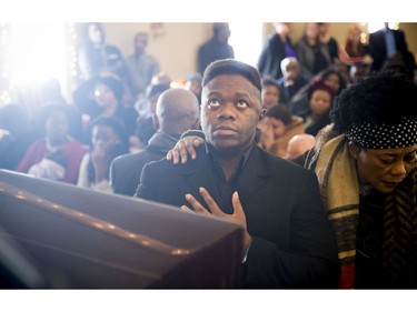 David Muzaliwa pays his respects at his sisters coffin Saturday