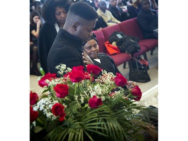 David Muzaliwa pays his respects at his sisters coffin Saturday