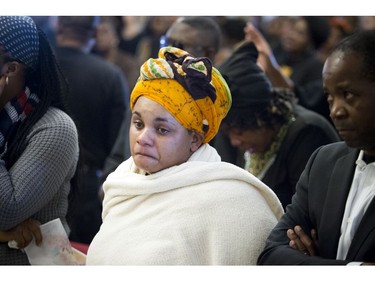 A mourner at the funeral for sisters Elizabeth Muzaliwa and  Rehema Muzaliwa Saturday