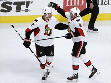 Ottawa Senators' Bobby Ryan (9) celebrates his goal with Marc Methot during the first period of an NHL hockey game against the Chicago Blackhawks Tuesday, Dec. 20, 2016, in Chicago.