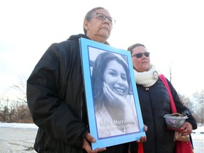 Bridget Tolley, left, and Elaine Kicknosway listen to Sgt. Jean-Paul Le May talk at a news conference this week about the details of the events leading to the death of Kelly Morrisseau 10 years ago.