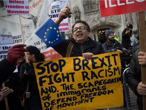 Anti-Brexit demonstrators protest outside the Supreme court building in London on the first day of a four-day hearing on December 5, 2016. The government of Prime Minister Theresa May will today seek to overturn a ruling that it must obtain parliamentary approval before triggering Brexit, in a highly-charged case in Britain's highest court.