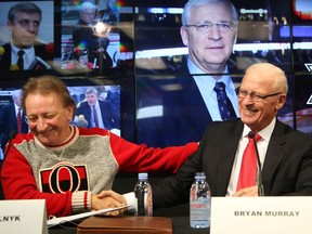 Bryan Murray was inducted in the Ring of Honour by Senators owner Eugene Melnyk (L) at Canadian Tire Centre in Ottawa, December 16, 2016.