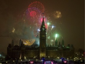 Fireworks explode over Parliament Hill to celebrate New Year's Eve and Canada's 150th anniversary of Confederation on Parliament Hill in Ottawa, Saturday, December 31, 2016.