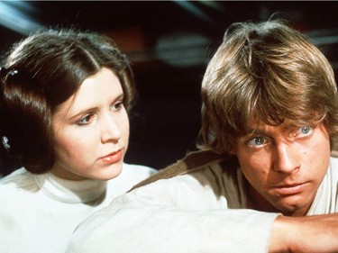 Carrie Fisher as Princess Leia and Mark Hamill as Luke Skywalker in Star Wars.