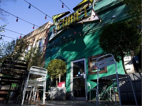 FILE - This Dec. 5, 2016 file photo shows the front door of Comet Ping Pong pizza shop, in Washington. An armed man arrived at Comet Ping Pong recently to investigate a sex trafficking conspiracy theory.