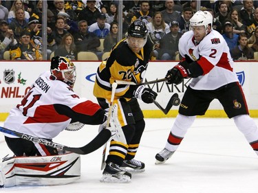 Pittsburgh Penguins' Patric Hornqvist (72) can't get his stick on a rebound in front of Ottawa Senators goalie Craig Anderson (41) with Dion Phaneuf (2) defending in the second period of an NHL hockey game in Pittsburgh, Monday, Dec. 5, 2016.