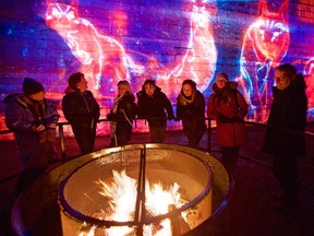 With winter winds blowing off Lake Ontario, fire pits at Fort Henry's new sound and light show, Lumina Borealis, are a popular spot to warm up.  The event takes place at the historic site until early February.
