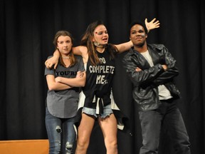 Dos played by Emma Hancock (L), Cop played by Madison Bates (C), and Alawa played by Spencer Arseneault-Deraps (R), in St. Mark High School's Cappies production of A Spare Me held on December 17, 2016