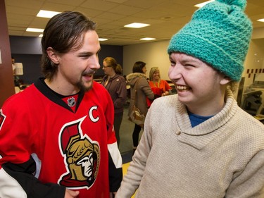 Erik Karlsson has a chuckle with Austin Ritz, 17, as the Ottawa Senators make their annual Christmas visit to CHEO and visit with some of the children and staff. They also brought gifts including a DSLR camera, video games, movies, blankets and plush Sparty dolls for CHEO's use in its effort to enhance the lives of hospital patients.