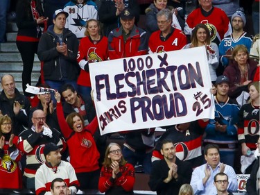 Fans of Ottawa Senators right wing Chris Neil (25) from his hometown of Flesherton, Ontario during a ceremony to celebrate his 1000th NHL game prior to the game against the San Jose Sharks at the Canadian Tire Centre on Wednesday December 14, 2016. Errol McGihon/Postmedia