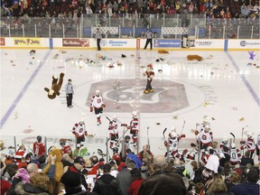 Fans throw plush toys onto the ice to raise money for CHEO after the Ottawa 67's score their first goal during OHL hockey action at TD Place arena against the Oshawa Generals on Saturday, Dec. 10, 2016.